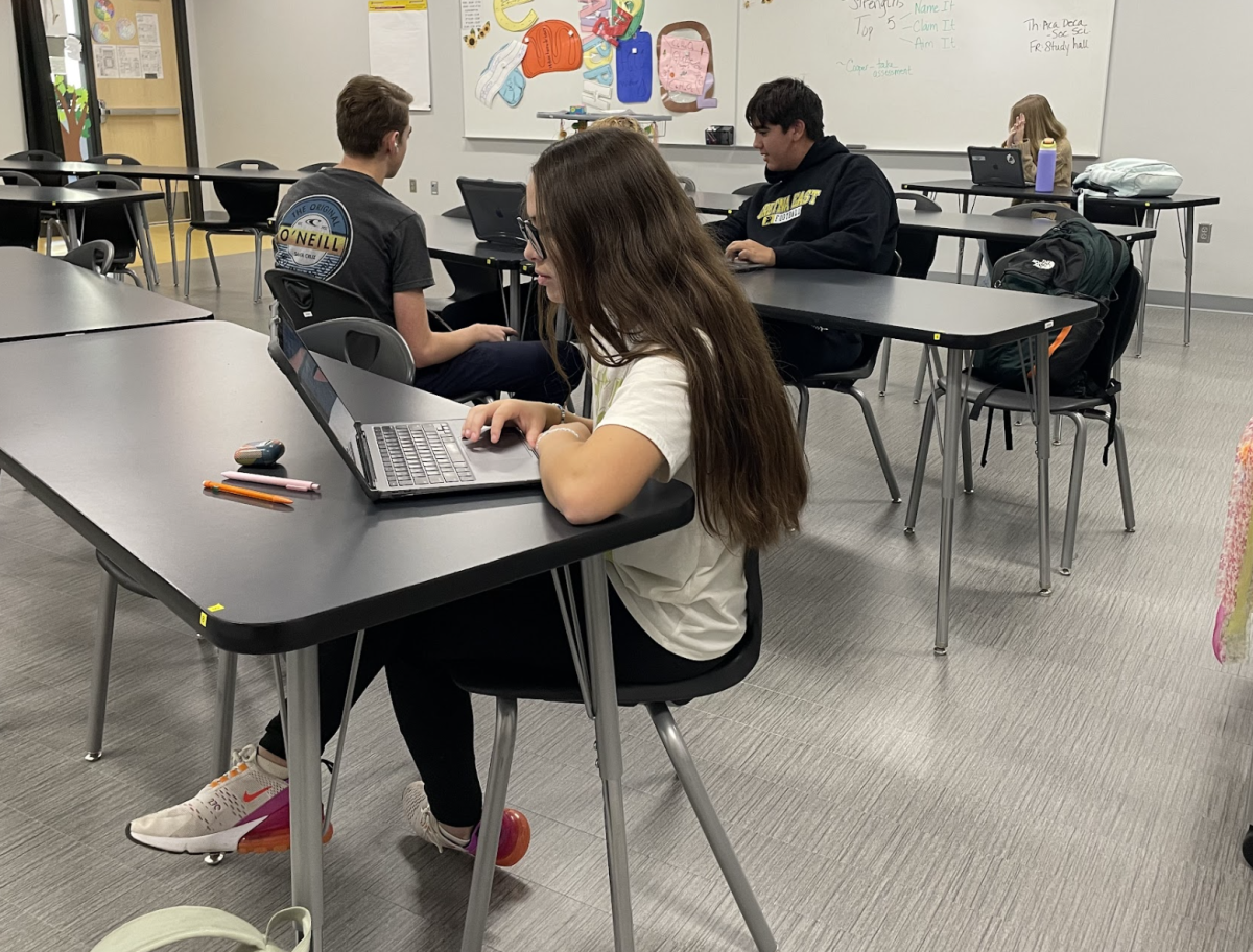 Working on an assignment, freshmen Ava Revis, Elijah Smith and Zachary Evans sit in Dawn Nizzi's third hour Integrated Studies class on Nov. 11. 